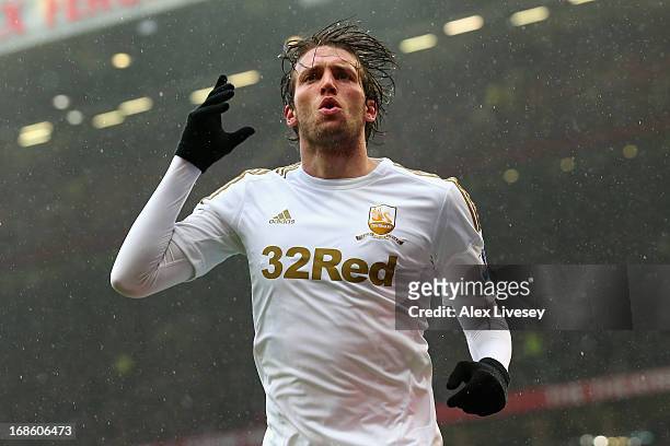 Miguel Michu of Swansea City celebrates scoring his team's first goal to make the score 1-1 during the Barclays Premier League match between...