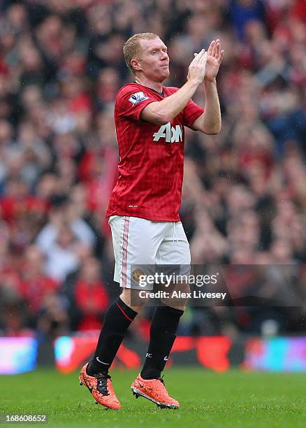 Paul Scholes of Manchester United acknowledges the crowd as he is substituted in his final game for the club during the Barclays Premier League match...