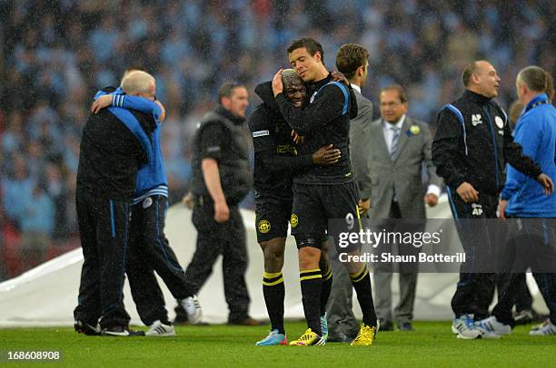 Arouna Kone and Franco Di Santo of Wigan Athletic celebrate following their team's victory during the FA Cup with Budweiser Final between Manchester...