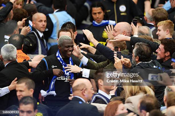 Arouna Kone of Wigan Athletic celebrate with the fans following their team's victory during the FA Cup with Budweiser Final between Manchester City...