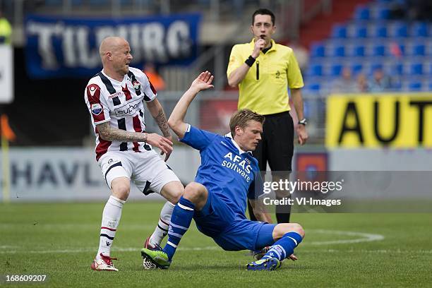 Danny Guijt of Willem II, Viktor Elm of AZ, referee Dennis Higler during the Dutch Eredivisie match between Willem II and AZ Alkmaar on May 12, 2013...