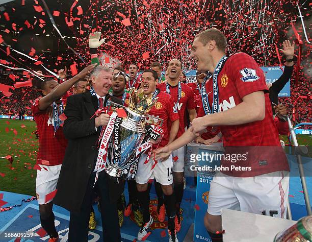 Manager Sir Alex Ferguson of Manchester United and Nemanja Vidic lift the Premier League trophy after the Barclays Premier League match between...