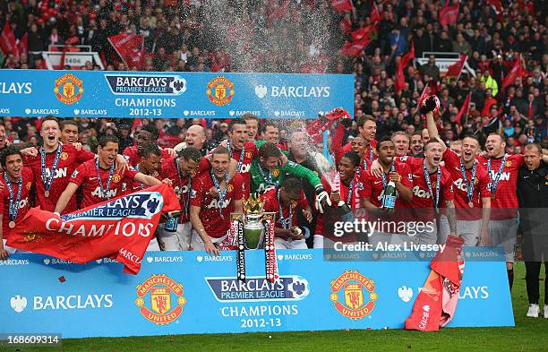 The Manchester United players celebrate with the Premier League trophy following the Barclays Premier League match between Manchester United and...