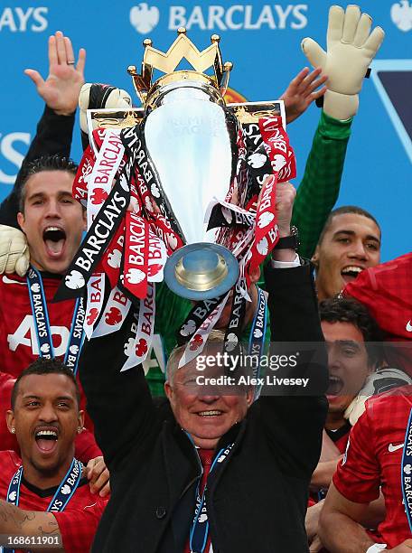 Manchester United Manager Sir Alex Ferguson lifts the Premier League trophy following the Barclays Premier League match between Manchester United and...