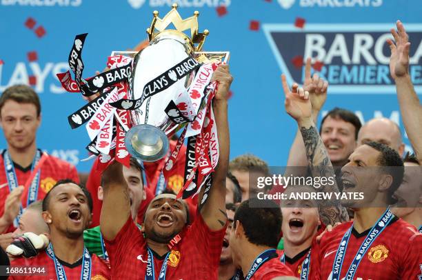 Manchester United's Brazilian midfielder Anderson lifts the Premier League trophy after the English Premier League football match between Manchester...