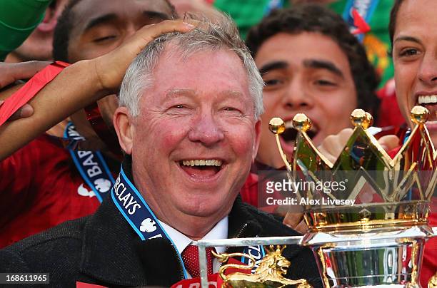 Manchester United Manager Sir Alex Ferguson celebrates with the Premier League trophy following the Barclays Premier League match between Manchester...