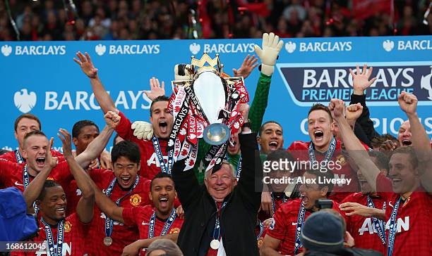 Manchester United Manager Sir Alex Ferguson lifts the Premier League trophy following the Barclays Premier League match between Manchester United and...