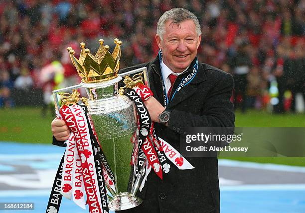 Manchester United Manager Sir Alex Ferguson celebrates with the Premier League trophy following the Barclays Premier League match between Manchester...