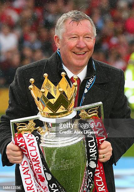 Manchester United Manager Sir Alex Ferguson celebrates with the Premier League trophy following the Barclays Premier League match between Manchester...