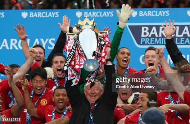 Manchester United Manager Sir Alex Ferguson lifts the Premier League trophy following the Barclays Premier League match between Manchester United and...