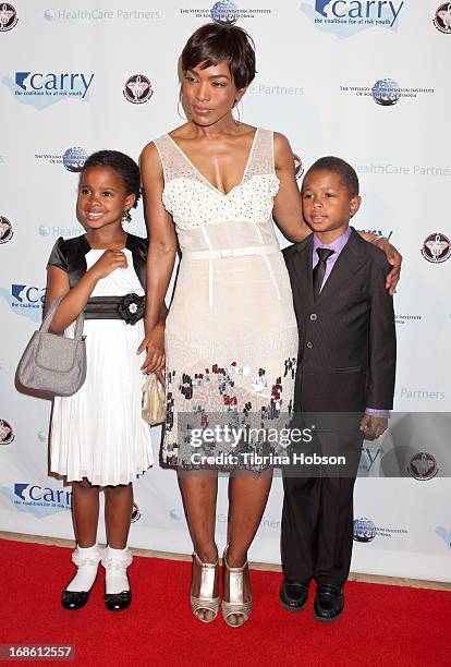 Angela Bassett and her children Bronwyn Vance and Slater Vance attend the 'Shall We Dance' annual gala for the coalition for at-risk youth at The...