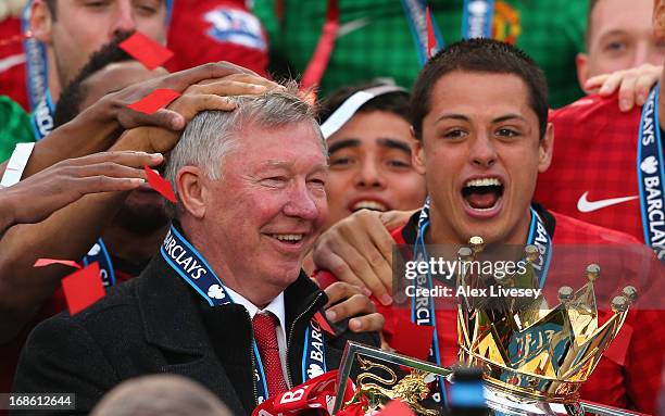 Manchester United Manager Sir Alex Ferguson celebrates with his players and the Premier League trophy following the Barclays Premier League match...