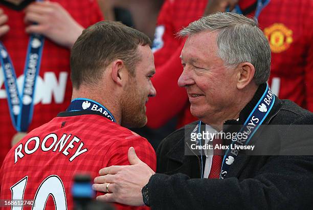 Manchester United Manager Sir Alex Ferguson congratulates Wayne Rooney following the Barclays Premier League match between Manchester United and...
