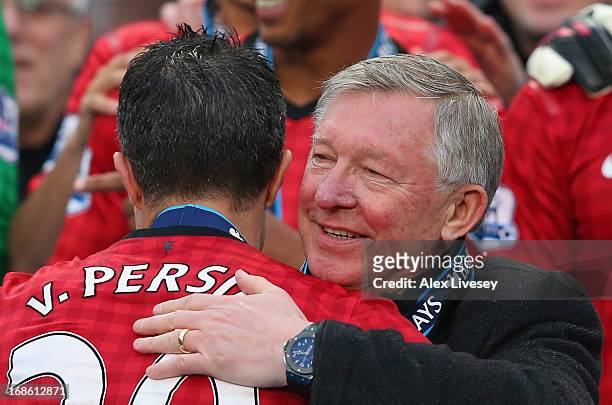 Manchester United Manager Sir Alex Ferguson congratulates Robin van Persie following the Barclays Premier League match between Manchester United and...