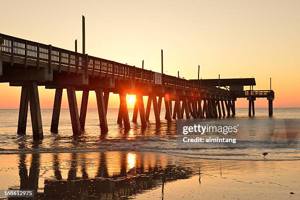 pier of tybee island beach at sunrise - tybee island stock pictures, royalty-free photos & images