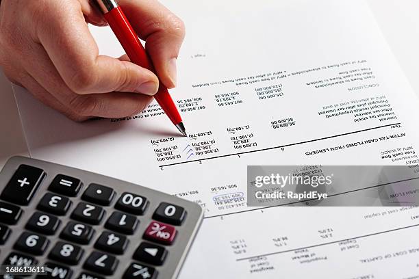 Hand Puts Check Marks On Financial Document Calculator Standing By High ...