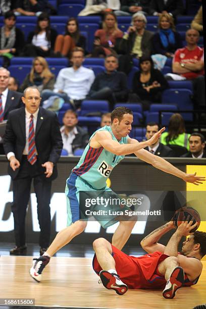 Vladimir Micov, #5 of CSKA Moscow competes with Marcelinho Huertas, #9 of FC Barcelona Regal during the Turkish Airlines EuroLeague Final Four game...