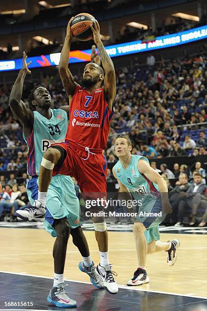 Aaron Jackson, #7 of CSKA Moscow competes with Papa Mbaye, #34 of FC Barcelona Regal during the Turkish Airlines EuroLeague Final Four game 3rd and...