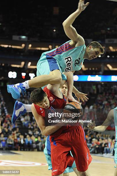 Xavier Rabaseda, #22 of FC Barcelona Regal competes with Viktor Khryapa, #31 of CSKA Moscow during the Turkish Airlines EuroLeague Final Four game...