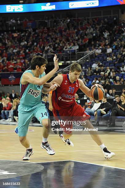 Viktor Khryapa, #31 of CSKA Moscow competes with Marko Todorovic, #14 of FC Barcelona Regal during the Turkish Airlines EuroLeague Final Four game...