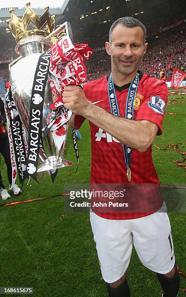 Ryan Giggs of Manchester United celebrates with the Premier League trophy after the Barclays Premier League match between Manchester United and...