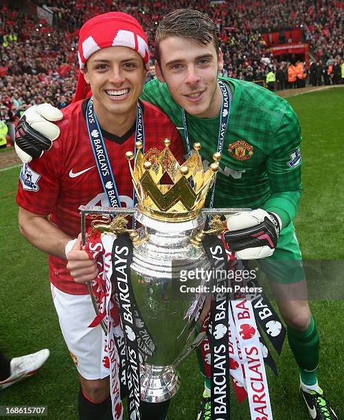 Javier "Chicharito" Hernandez and David de Gea of Manchester United celebrates with the Premier League trophy after the Barclays Premier League match...
