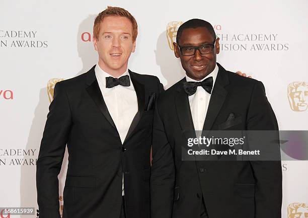 Presenters Damian Lewis and David Harewood pose in the press room at the Arqiva British Academy Television Awards 2013 at the Royal Festival Hall on...