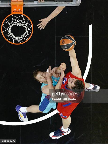 Sasha Kaun, #24 of CSKA Moscow competes with C.J. Wallace, #18 of FC Barcelona Regal during the Turkish Airlines EuroLeague Final Four game 3rd and...