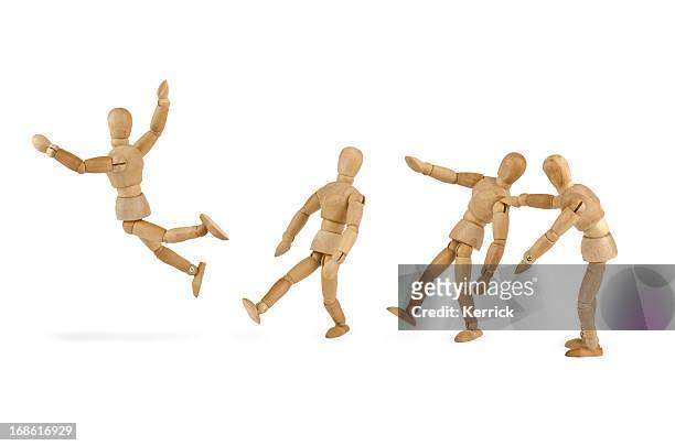 wooden mannequins bullying another - alone in a crowd sad stockfoto's en -beelden