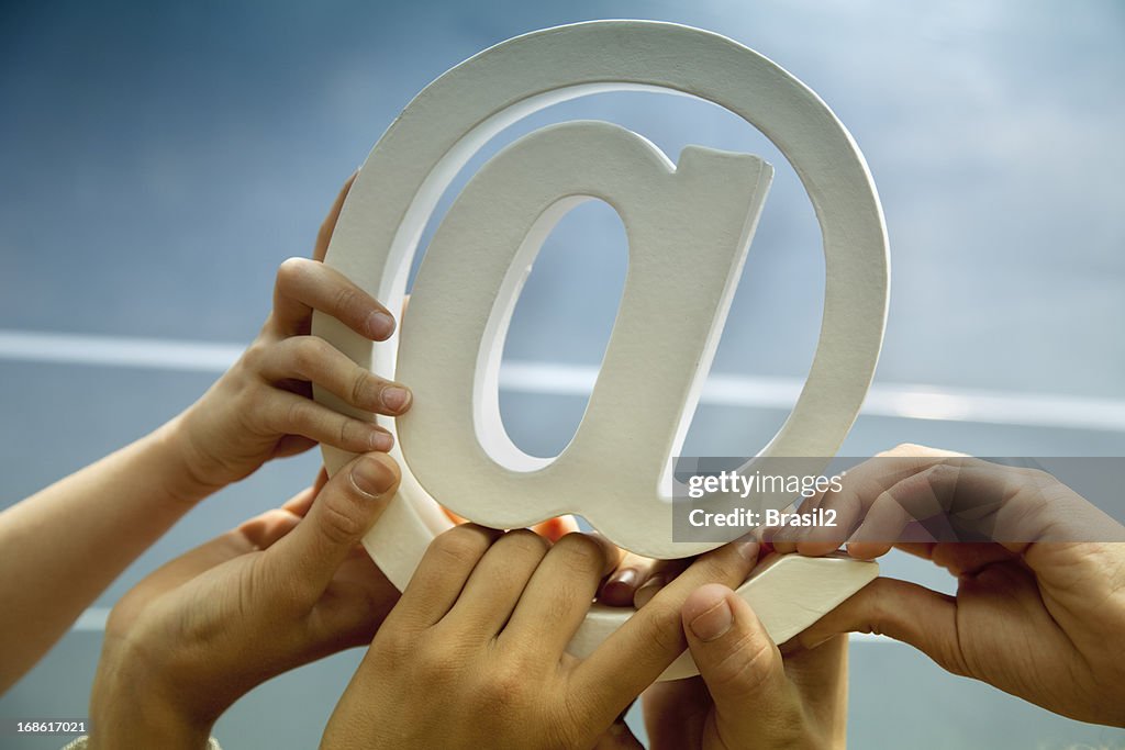 Hands holding email symbol