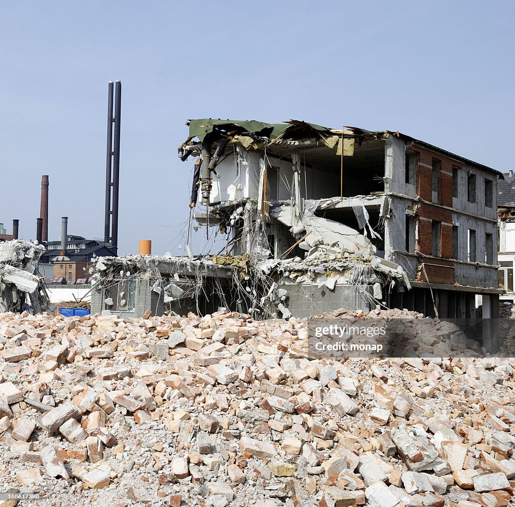 Pile of brick and demolished house