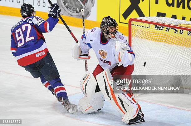 Slovakia's forward Branco Radivojevic celebrates scoring past Russia's goalkeeper Ilya Bryzgalov during the preliminary round match Slovakia vs...