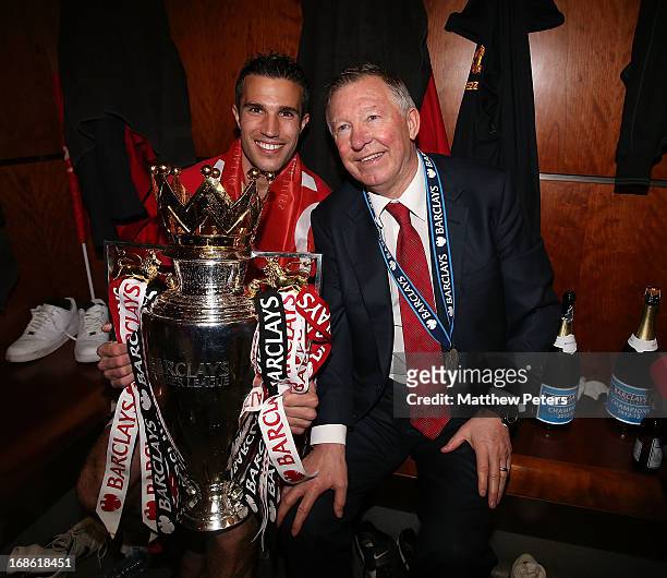 Robin van Persie and Manager Sir Alex Ferguson of Manchester United celebrate with the Barclays Premier League trophy in the dressing room after the...