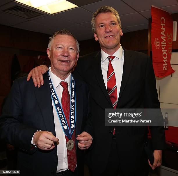 Chief Executive David Gill and Manager Sir Alex Ferguson of Manchester United celebrate in the dressing room after the Barclays Premier League match...