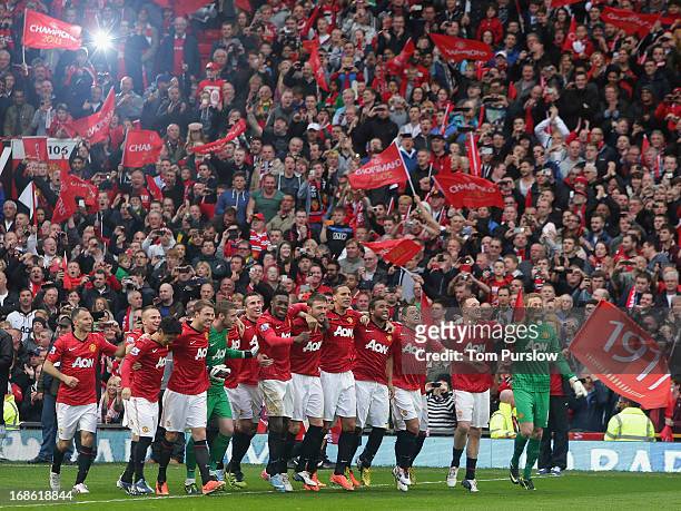 The Manchester United squad come out to lift the Premier League trophy after the Barclays Premier League match between Manchester United and Swansea...