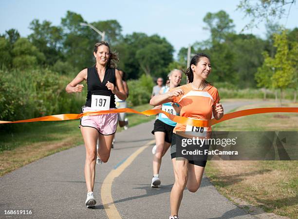 runner - finishing race stock pictures, royalty-free photos & images