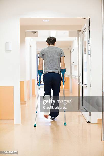 man with a broken leg at the hospital - crutch stock pictures, royalty-free photos & images