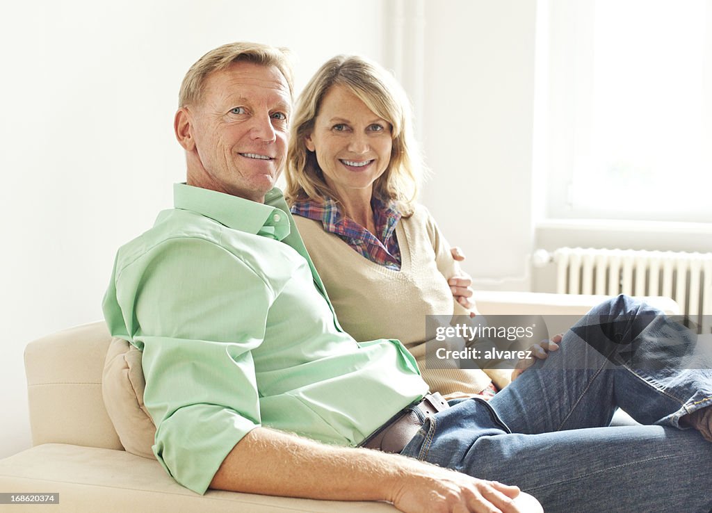 Mature adult couple in their living room