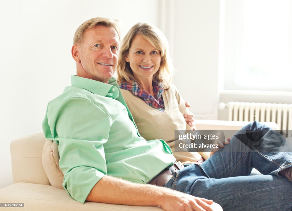 Mature adult couple in their living room