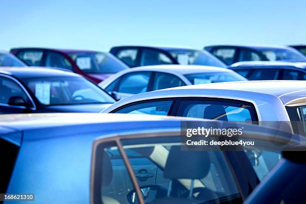 new and used cars - parked car stockfoto's en -beelden