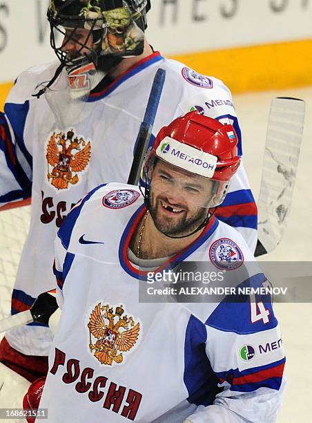Russia's forward Alexander Radulov celebrates a 3-1 victory in front of Russia's goalkeeper Ilya Bryzgalov during the preliminary round match...