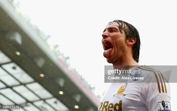 Miguel Michu of Swansea City celebrates scoring his team's first goal to make the score 1-1 during the Barclays Premier League match between...