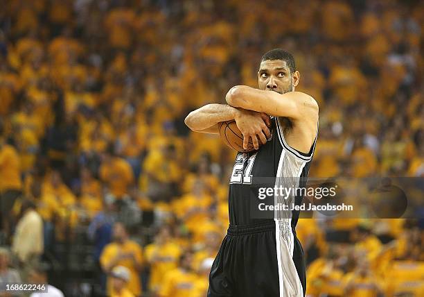 Tim Duncan of the San Antonio Spurs looks on against Golden State Warriors in Game Four of the Western Conference Semifinals during the 2013 NBA...