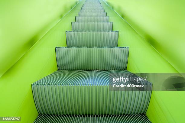 futuristic neon green escalator - neon catwalk stock pictures, royalty-free photos & images