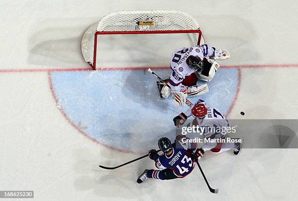 Tomas Surovy of Slovakia and Anton Belov of Russia battle for position in front of the net during the IIHF World Championship group H match between...