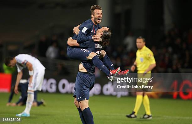 David Beckham and Zlatan Ibrahimovic of PSG celebrate the french Ligue 1 title of PSG after the Ligue 1 match between Olympique Lyonnais, OL, and...