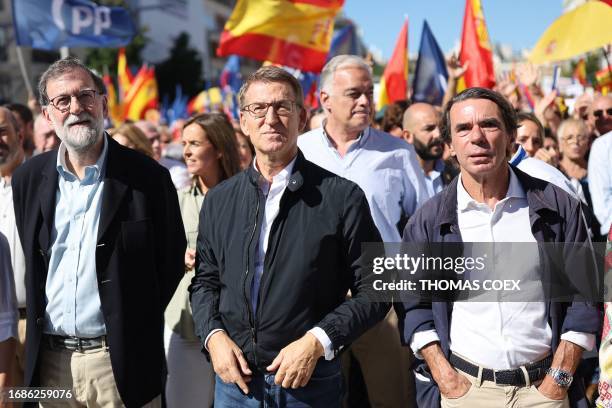 Former Spanish Prime Minister Mariano Rajoy, People's Party President Alberto Nunez Feijoo and former Spanish Prime Minister Jose Maria Aznar arrive...