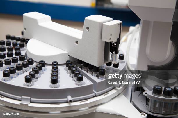 operating gas chromatograph autosampler - chromatography stock pictures, royalty-free photos & images