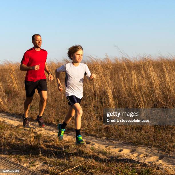 father and son - family jogging stock pictures, royalty-free photos & images