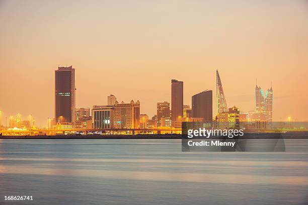bahrain manama skyline at night - bahrain skyline stock pictures, royalty-free photos & images